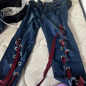V.I.P JEANS with red time up lace at the bottom